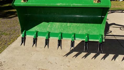 tooth bar for tractor buckets